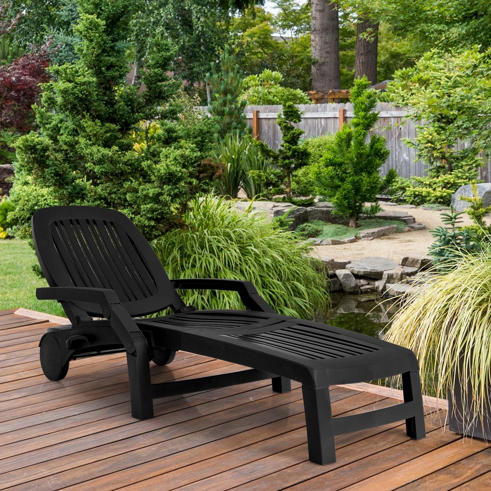 Adjustable Patio Sun Lounger with Weather Resistant Wheels-Black on wooden deck in garden setting