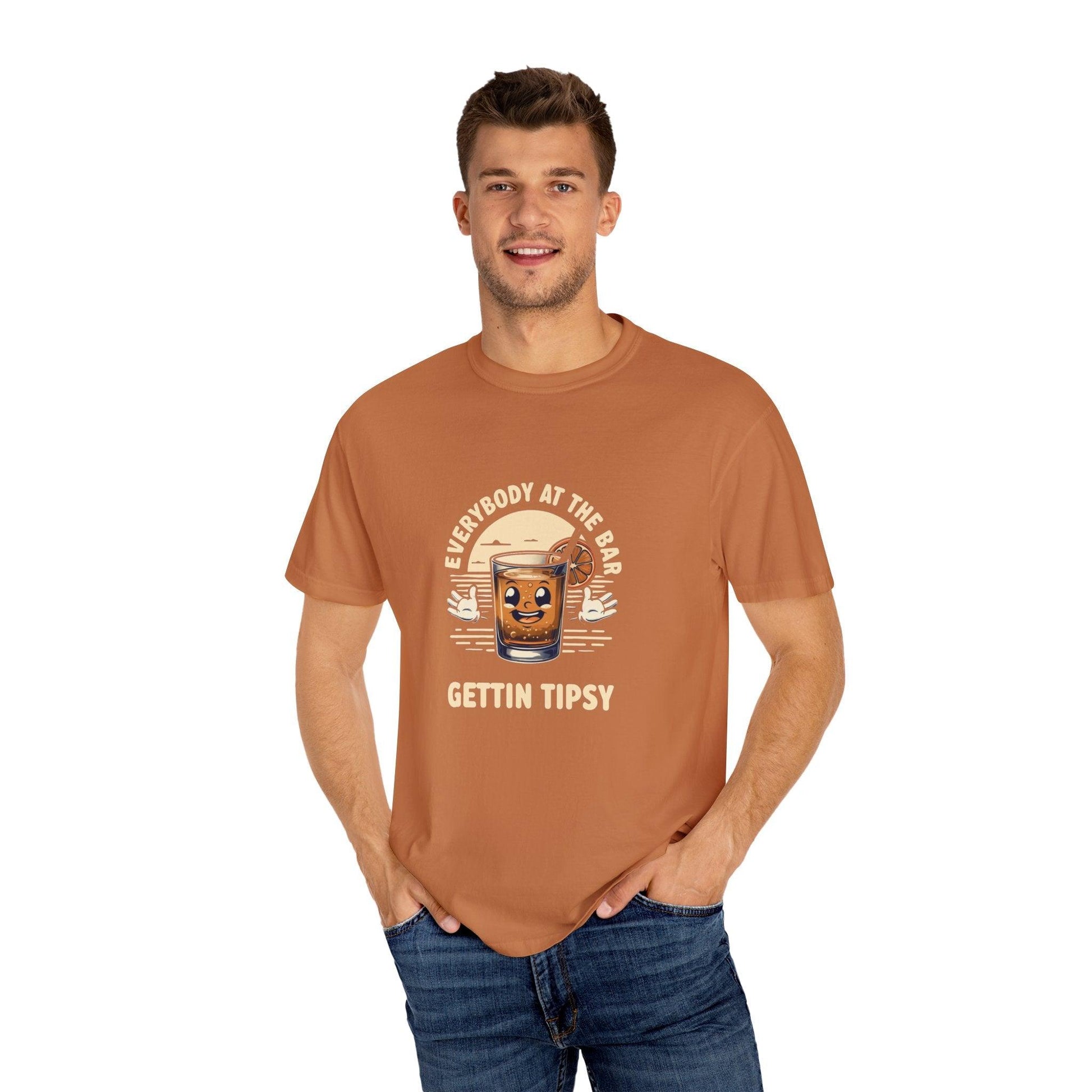 Model wearing Everybody at the Bar Gettin Tipsy Unisex Garment-Dyed T-Shirt with whiskey glass graphic and playful text.