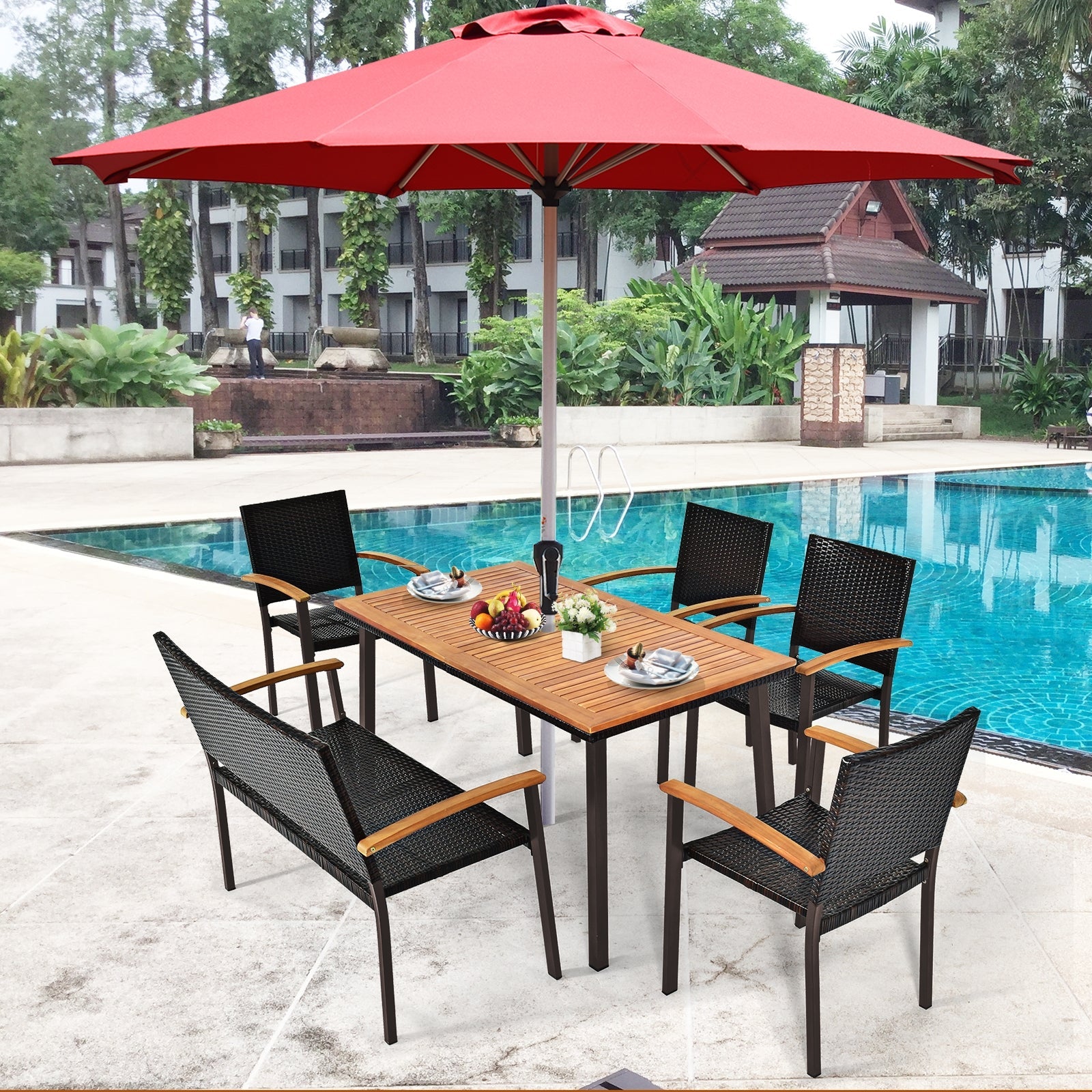 55 Inch Patio Acacia Dining Table with Umbrella Hole by the poolside, featuring slatted surface and rust-proof legs.