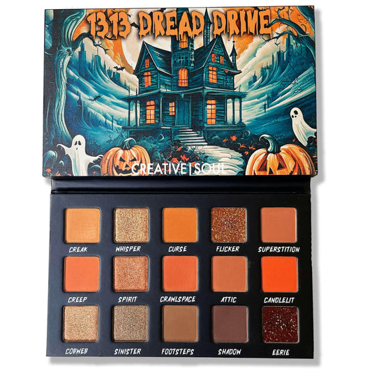 1313 Dread Drive Eyeshadow Palette with haunted house design, featuring various shades named Creak, Whisper, Curse, Flicker, and more.
