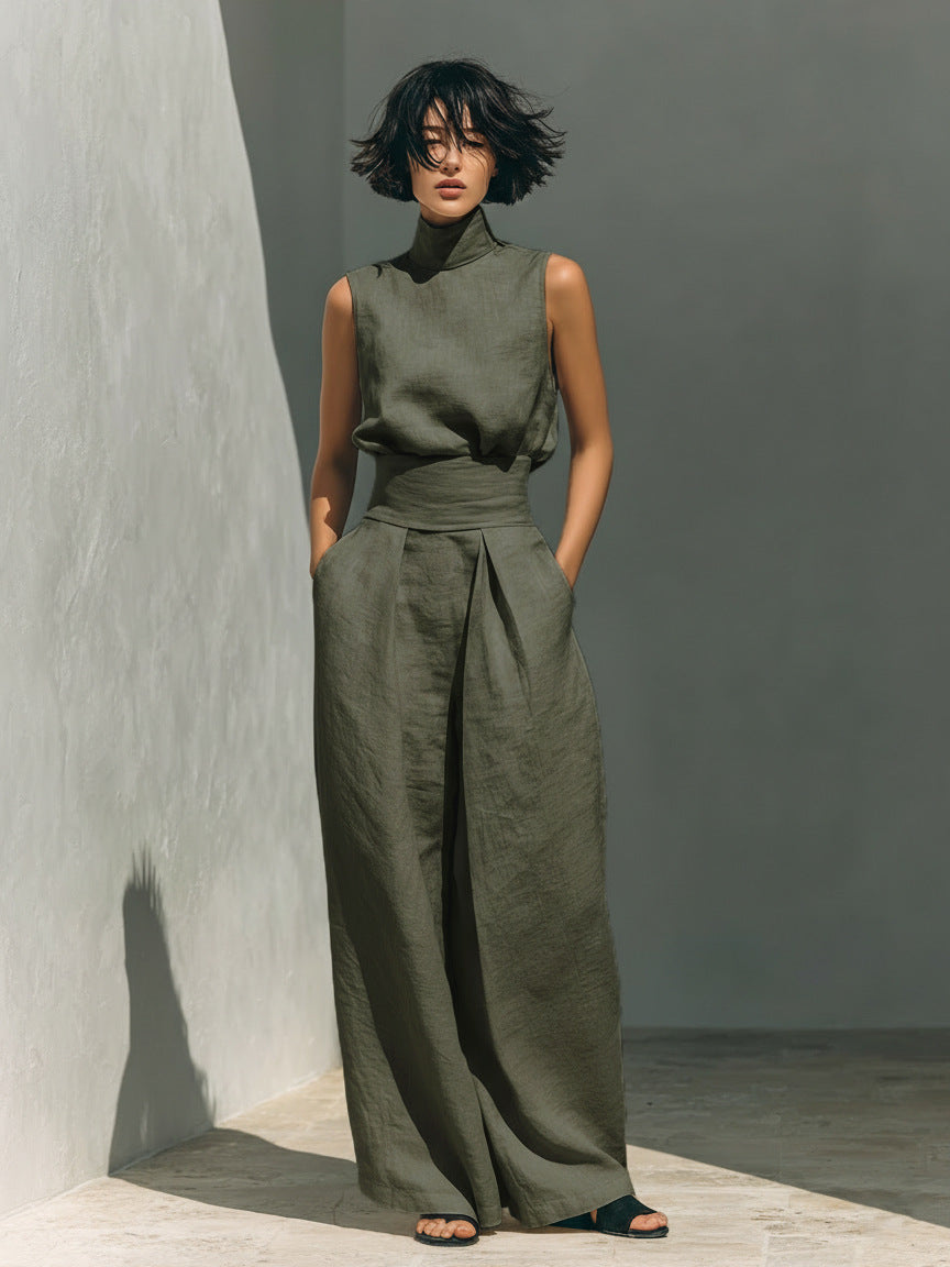 Woman wearing Women’s Cotton Linen Two-Piece Set – Sleeveless Top & Wide-Leg Pants in a minimalist setting.