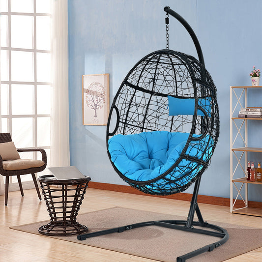 Hanging Cushioned Hammock Chair with Stand-Blue in a cozy indoor setting with plush pillow and cushion, enhancing relaxation and comfort.