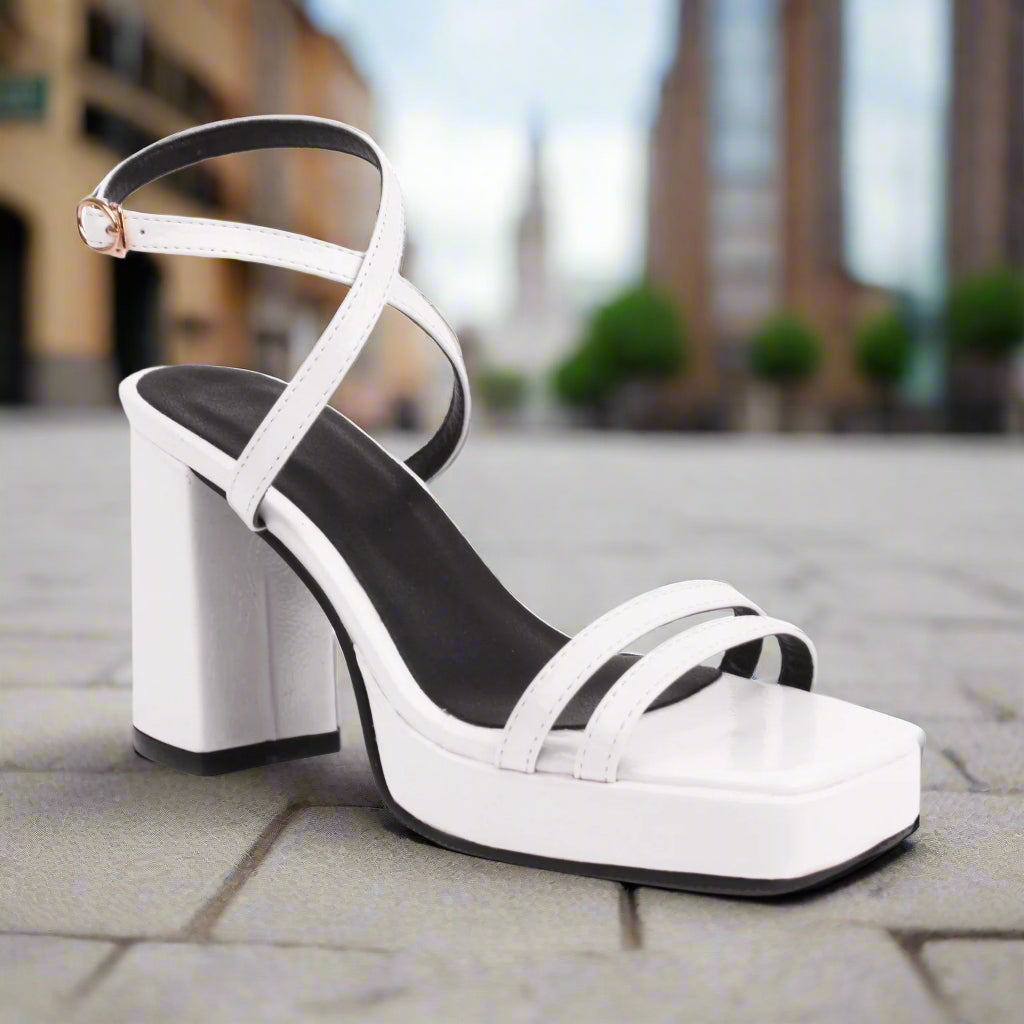 Square-Toe Buckle Strap High Heels – Elegant Thin-Strap Summer Block Heels in white on urban background