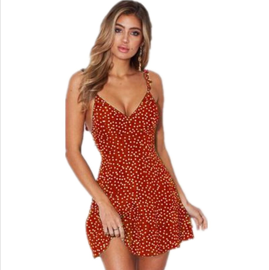 Woman wearing a red polka dot Women Summer Fashion Beach Sundress by FitiqueFit, perfect for beach outings and casual summer wear.