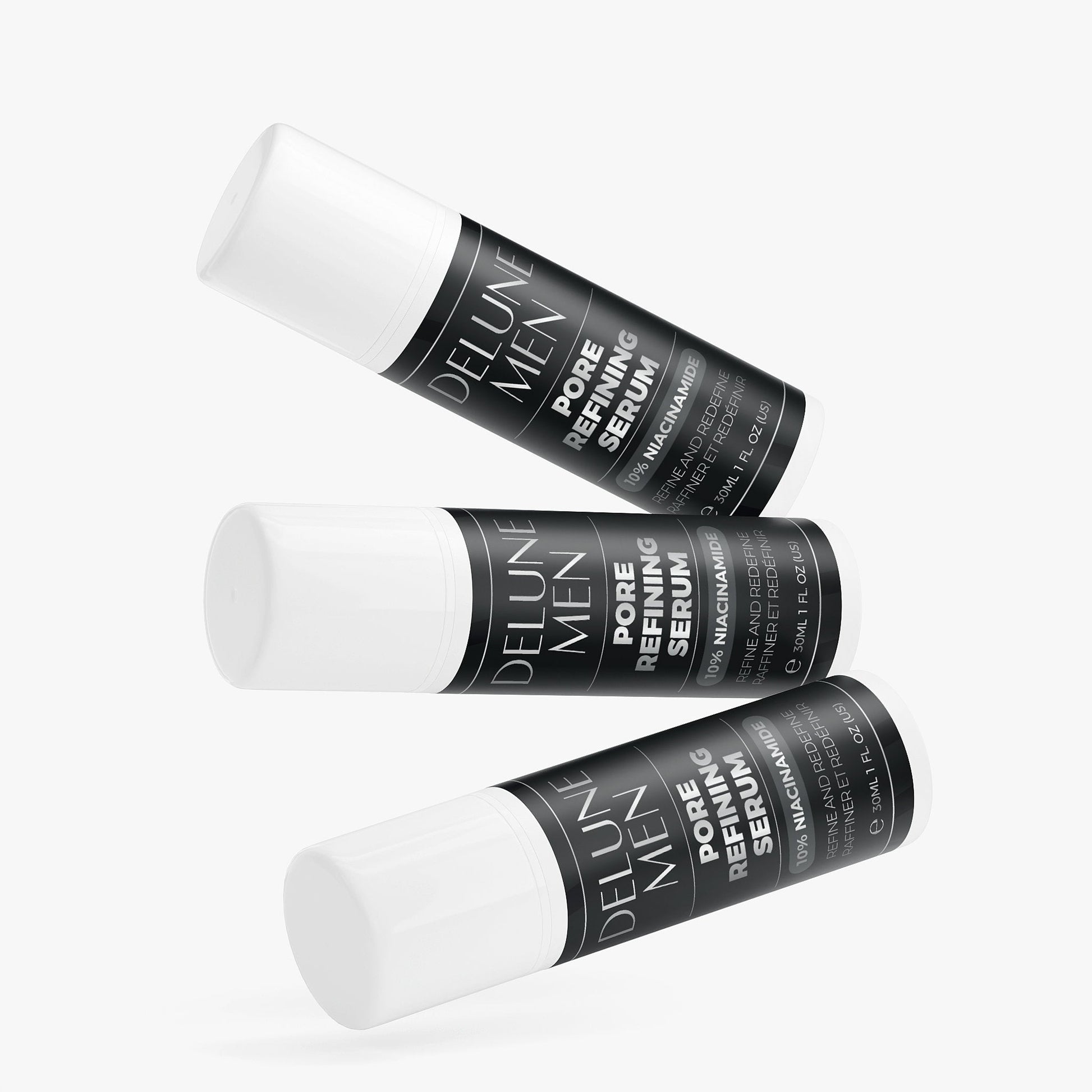 Three bottles of Pore Refining Serum with 10% Niacinamide for smoothing and refining skin texture against a light background.