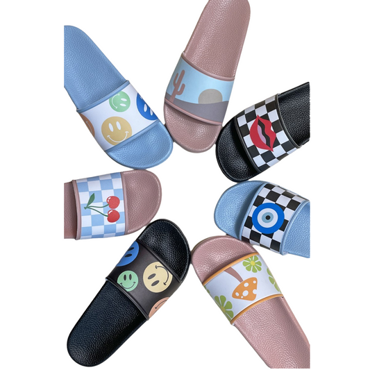 Novelty printed slides in various designs featuring emojis, symbols, and patterns. Available in sizes CHINA US36/37 to 42/43.