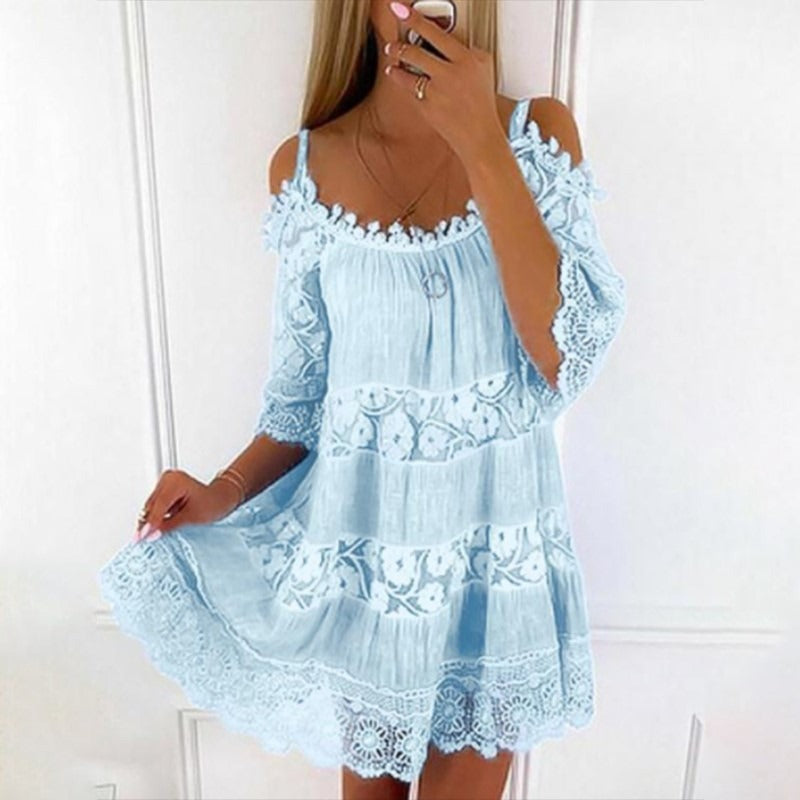 Woman wearing Lace Embrace Summer Sling Dress with lace and flying sleeves, perfect for sunny days on the ranch.
