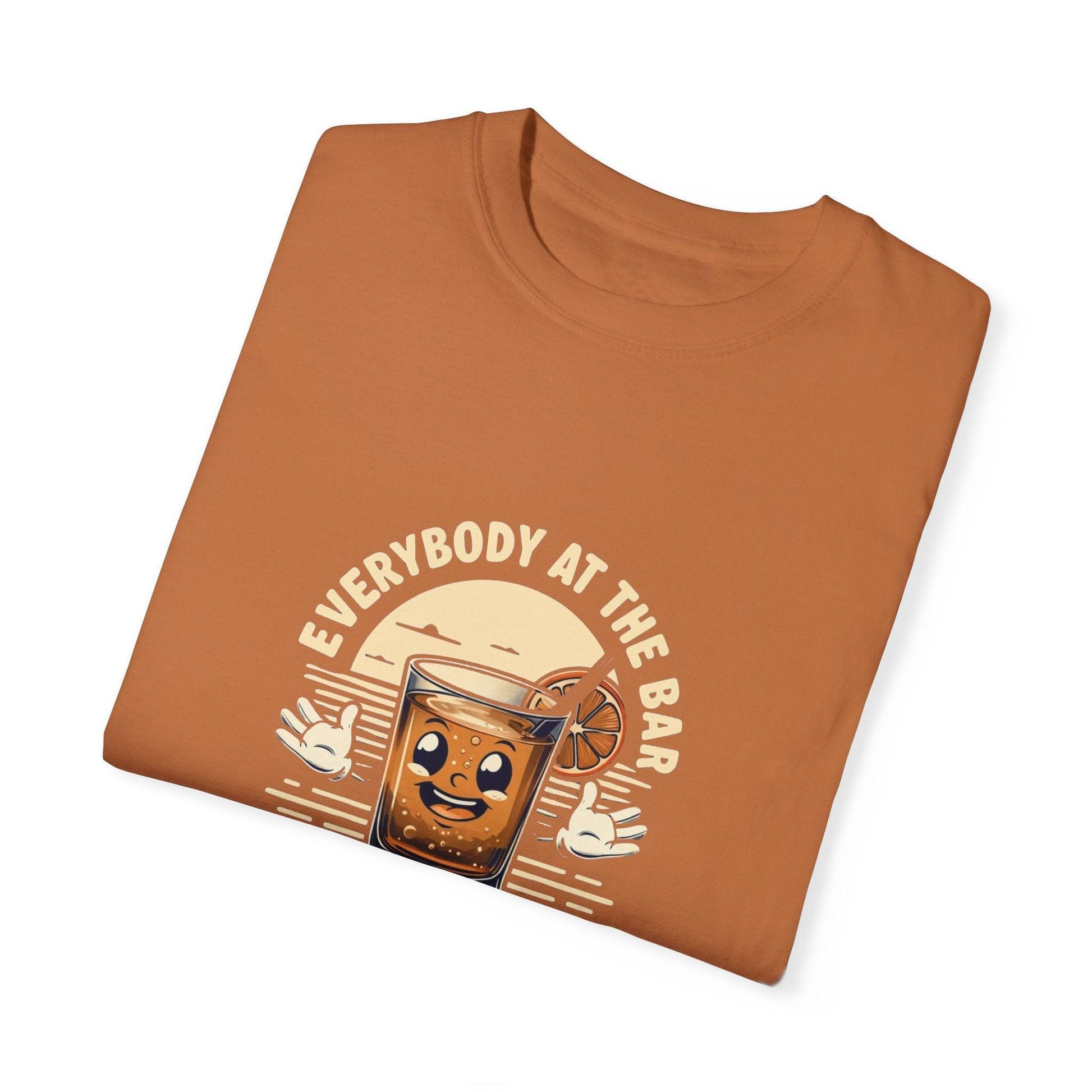 Everybody at the Bar Gettin Tipsy Unisex Garment-Dyed T-Shirt with whiskey glass graphic and playful design, folded view