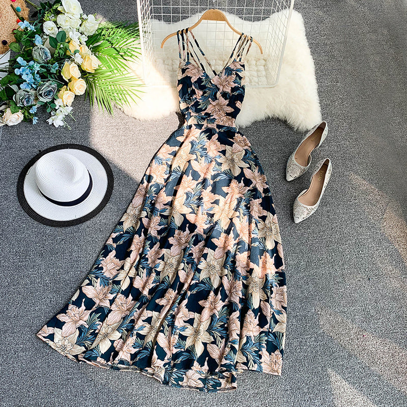 Floral patterned summer dress displayed with accessories