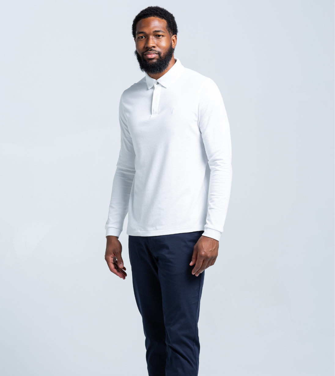 Man wearing Long Sleeve Perfect Polo in white, featuring StaySharp™ Collar and tailored fit for comfort and style.