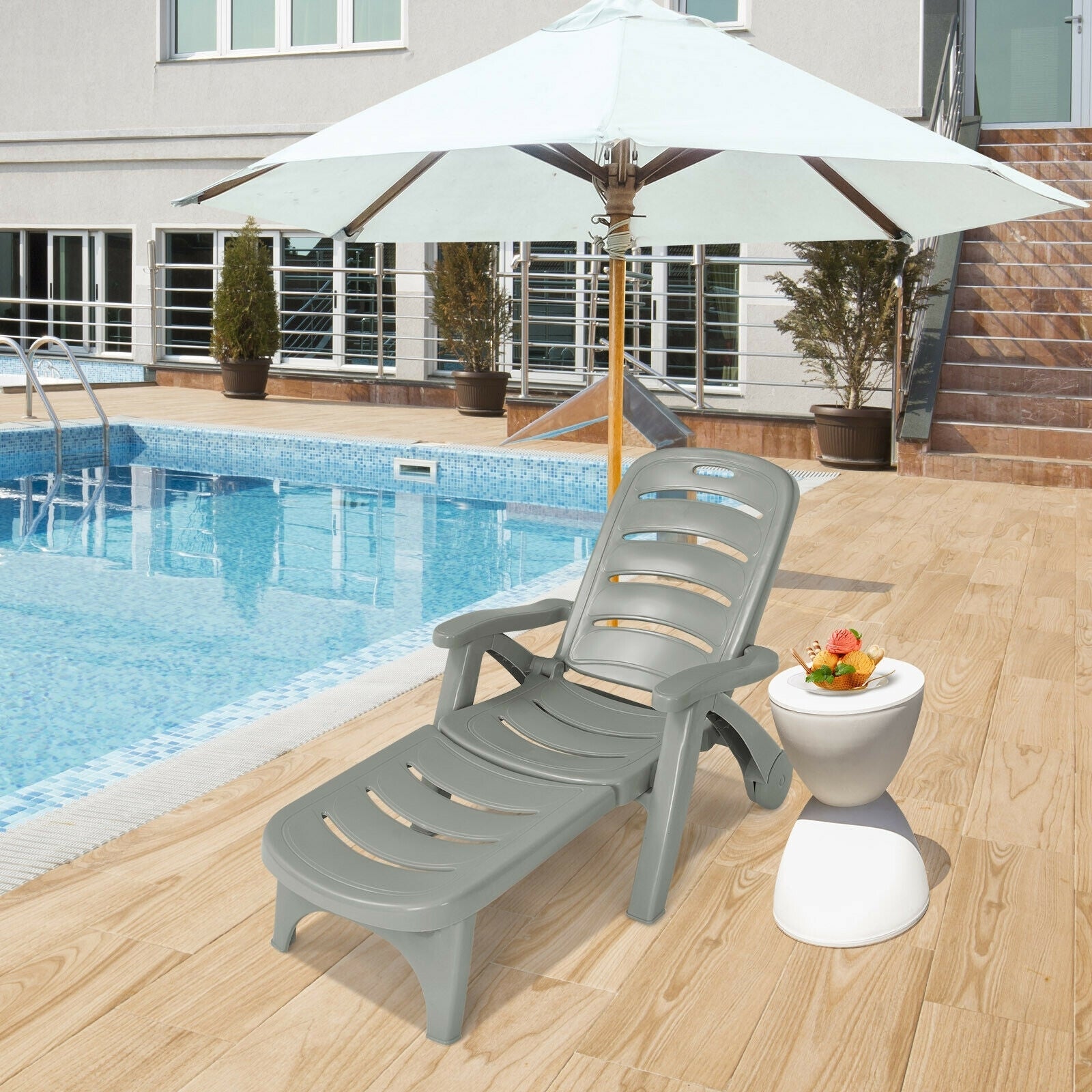 5 Position Adjustable Folding Lounger Chaise Chair-Gray by the pool with umbrella and small table for outdoor relaxation