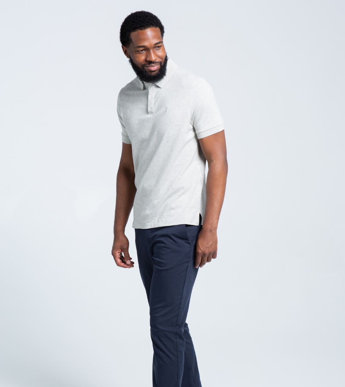 Man wearing Baobab Short Sleeve Perfect Polo with StaySharp™ Collar and tailored fit, designed for comfort and wrinkle-free style.