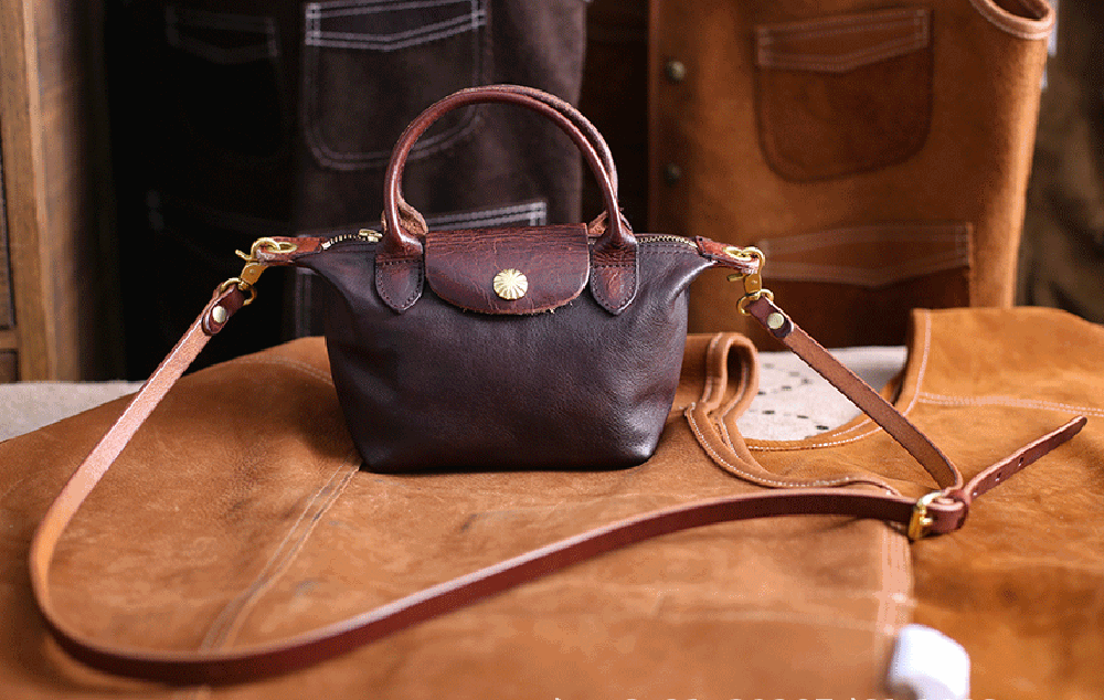 Vintage Luxe Horse Skin Leather Handbag with silver-tone hardware on leather backdrop