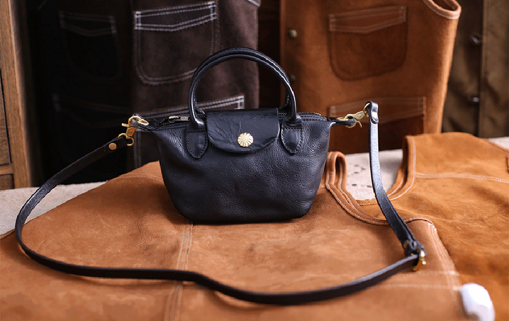 Vintage Luxe Horse Skin Leather Handbag with antique silver-tone hardware on a rustic backdrop.