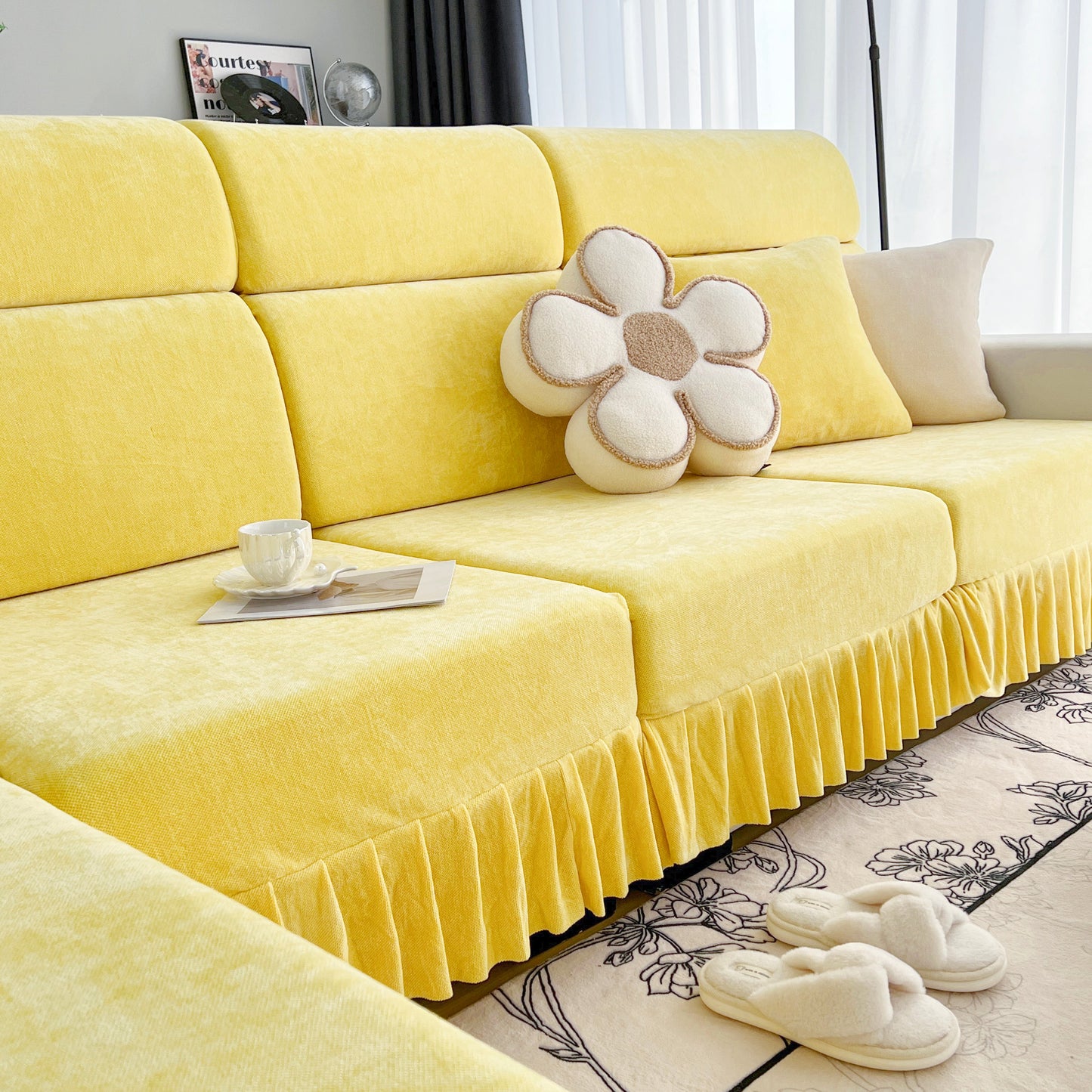 Universal Elastic Skirt Sofa Slipcover in yellow on modern sofa with decorative cushions, ideal for living room, bedroom, or office decor.