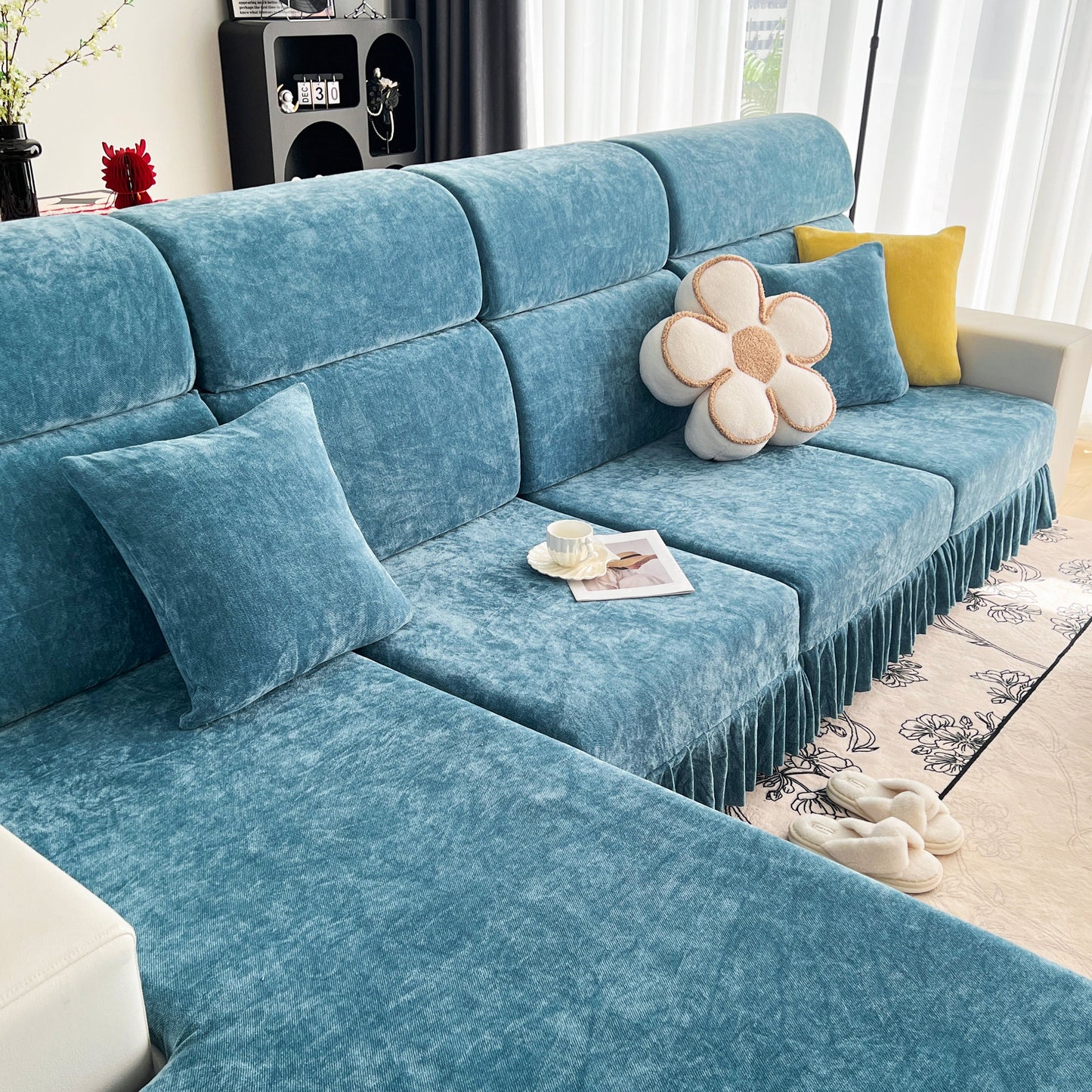 Universal Elastic Skirt Sofa Slipcover on modern living room sofa, offers protection and style, ideal for bedroom and office spaces.