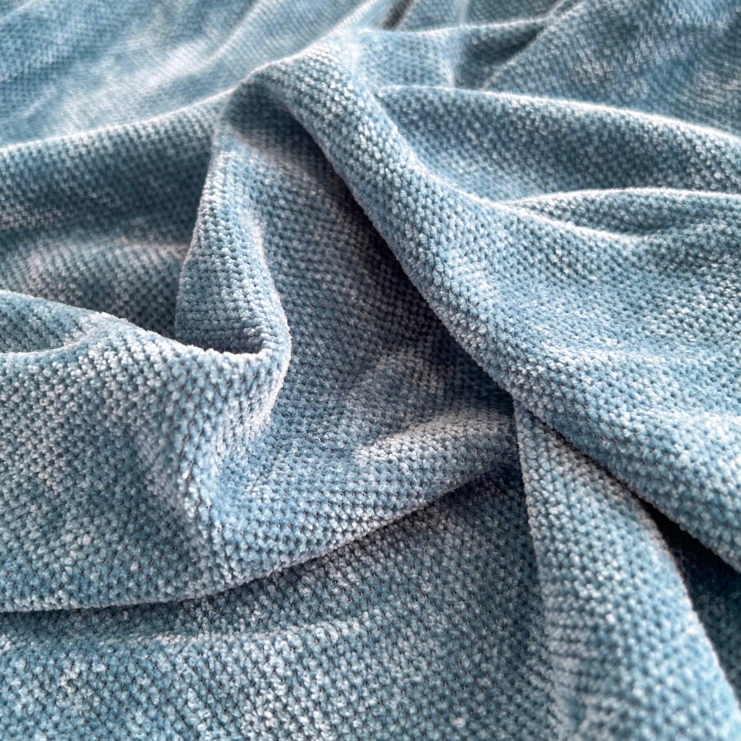 Close-up of luxurious Chenille fabric of Universal Elastic Skirt Sofa Slipcover, Stretch Sofa Cushion Cover For Bedroom Office Living Room.