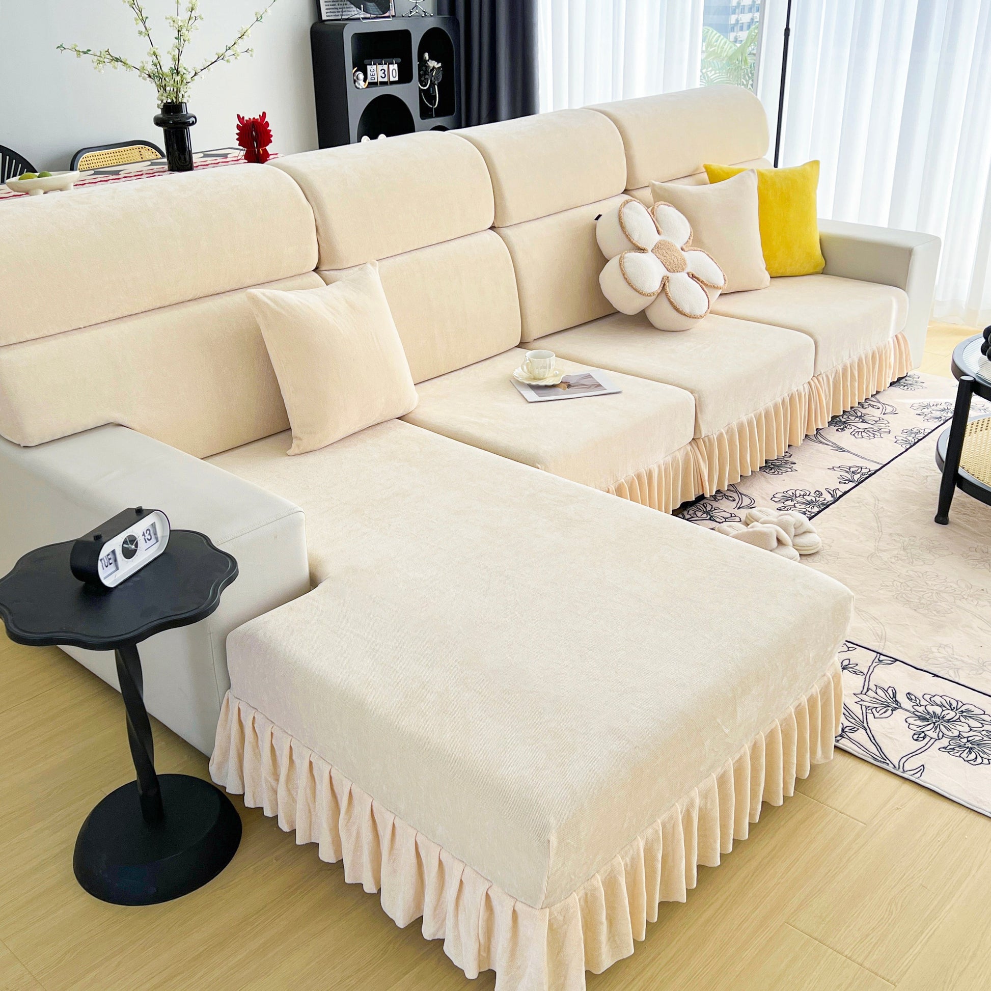 Beige Universal Elastic Skirt Sofa Slipcover in living room with floral cushions.