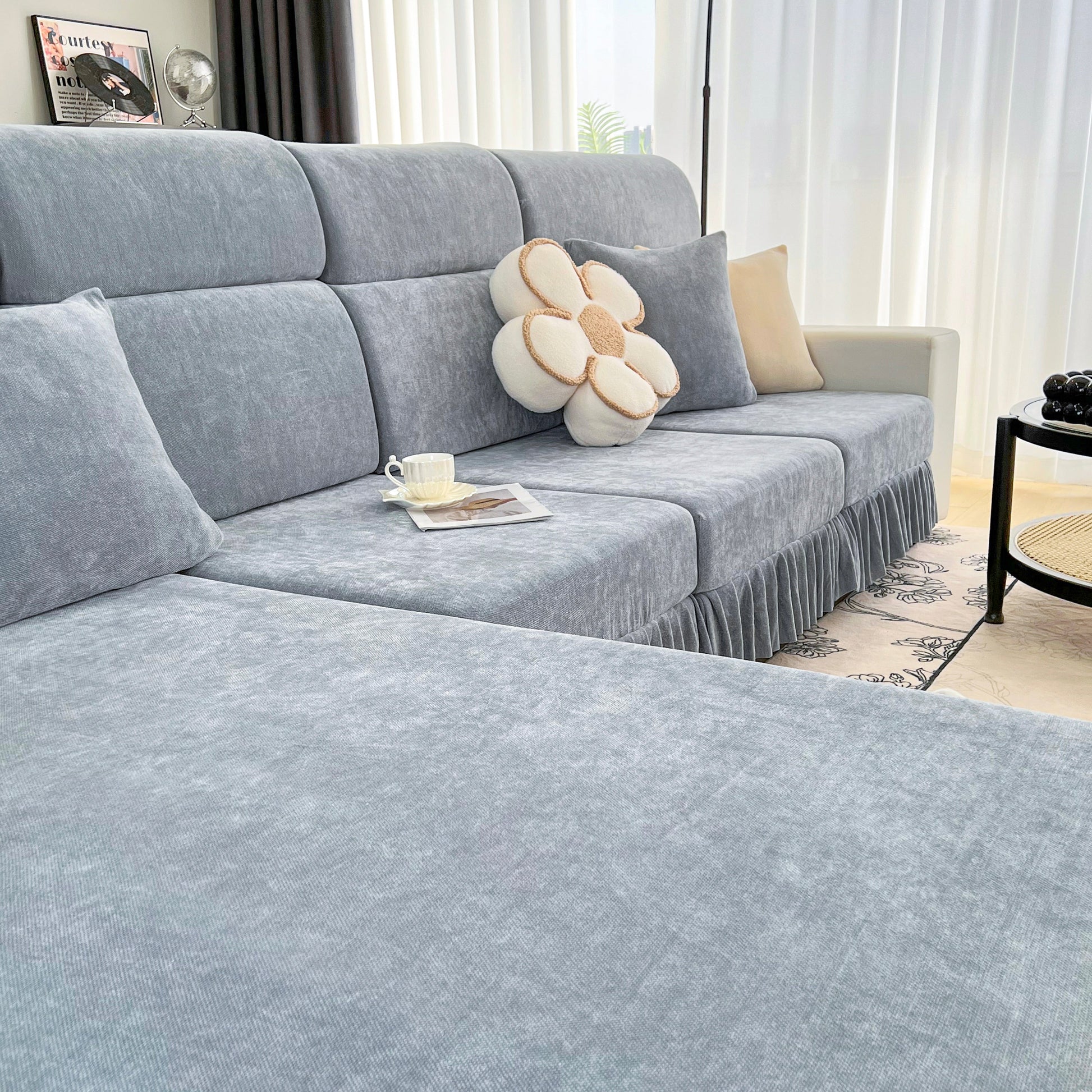 Universal Elastic Skirt Sofa Slipcover, Stretch Sofa Cushion Cover For Bedroom Office Living Room on a modern grey sofa.