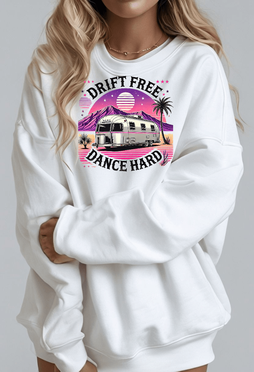 Drift Free, Dance Hard Women's Sweatshirt with vintage Airstream, desert landscape, neon pink and lavender hues.