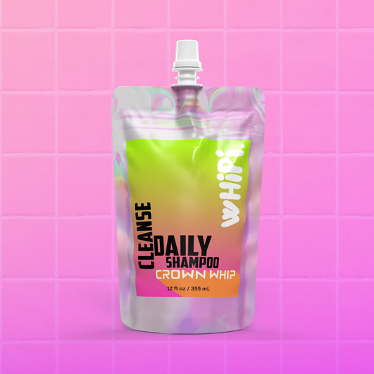 Cleanse – Crown Whip Daily Shampoo in vibrant pouch on pink tiled background