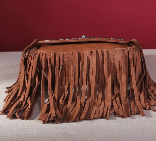 Montana West Fringe Mariposa Concho Collection Crossbody with brown fringe and Navajo conchos displayed against a red background.