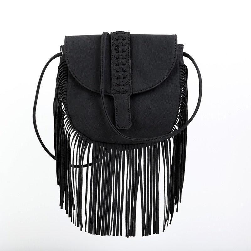 Dakota Tasseled Boho Leather Bag - Trendy Large Tassel Shoulder Bag in black with intricate weaving and fringe detail.