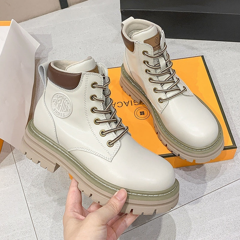Women’s Genuine Leather Martin Boots with thick elevator sole for style and comfort, displayed on a shoe box.
