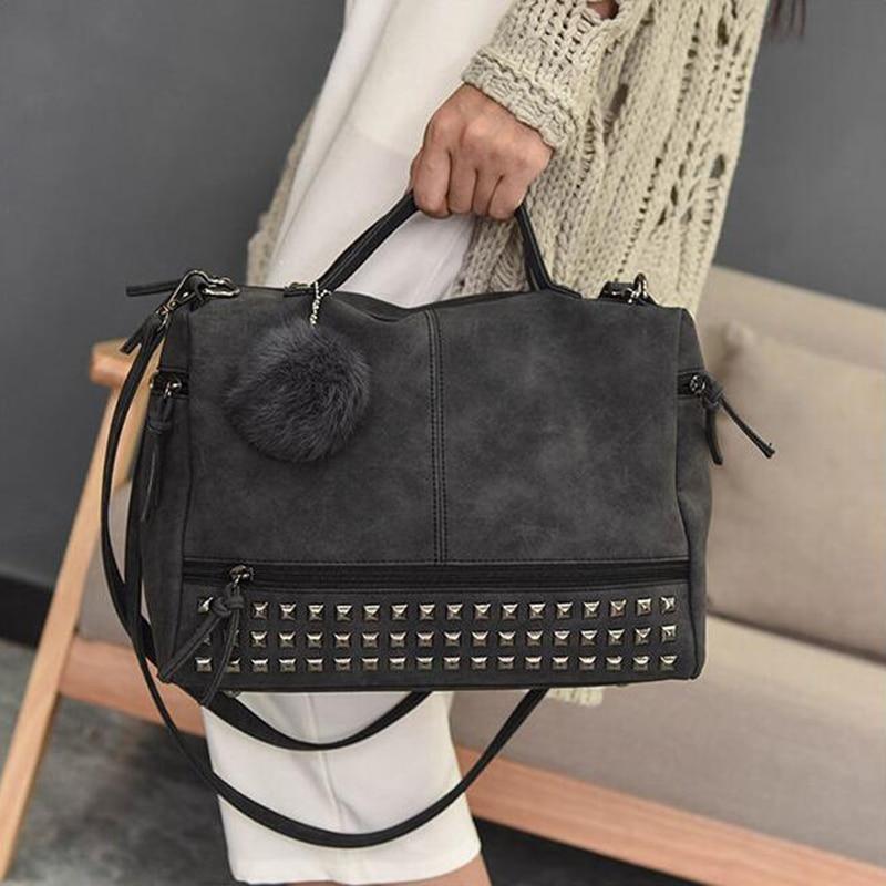 Rustic Charm Leather Shoulder Bag – Stylish Cowgirl Handbag with rivet details, soft structure, and pom-pom accent.