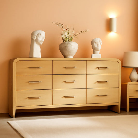 SolidOak Curved Nine Drawer Dresser SixtyThreeInches with natural wood grain and elegant decor in a stylish room setting.