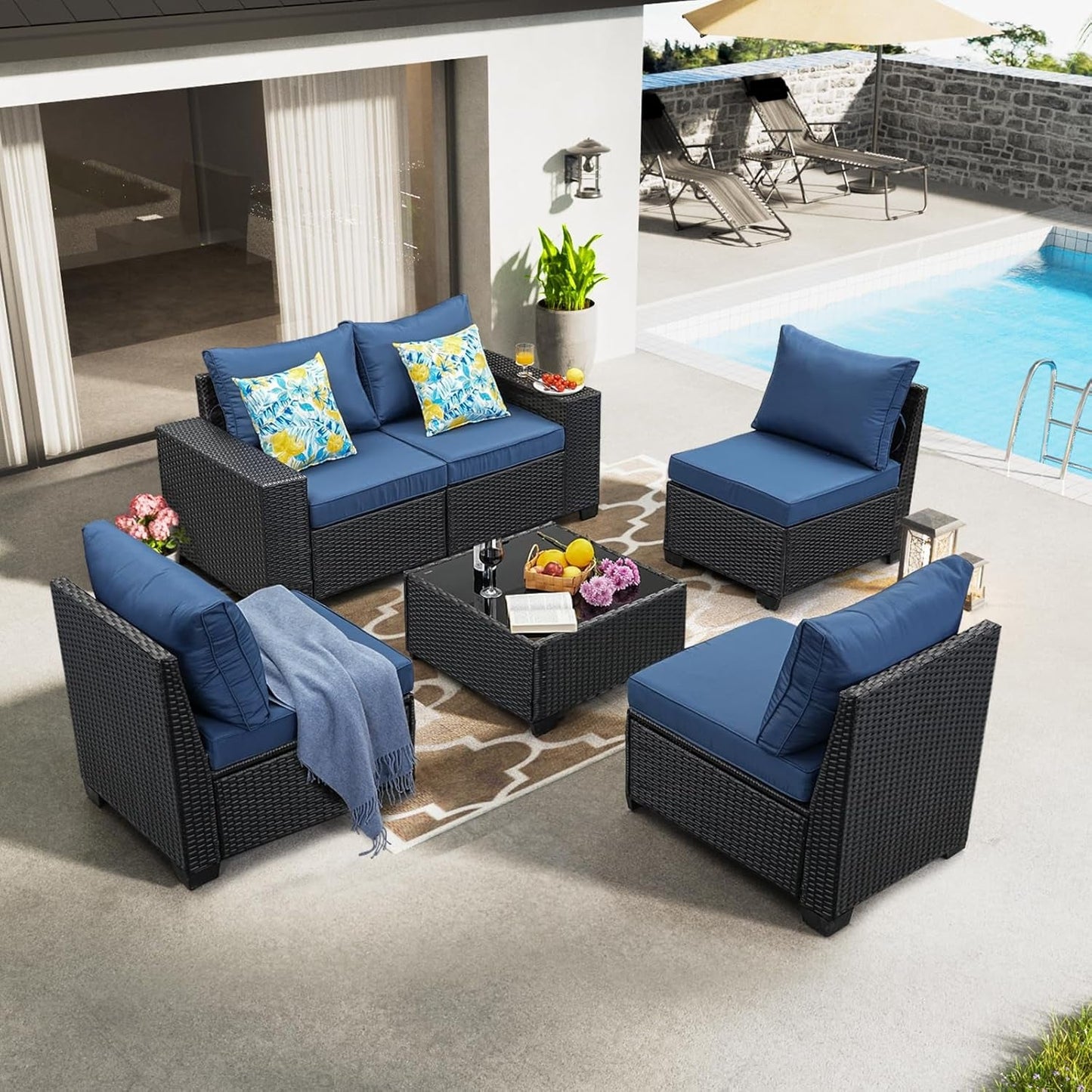Six Piece All Weather Outdoor Wicker Sectional Sofa Set in a patio setting with blue cushions and decorative throw pillows.