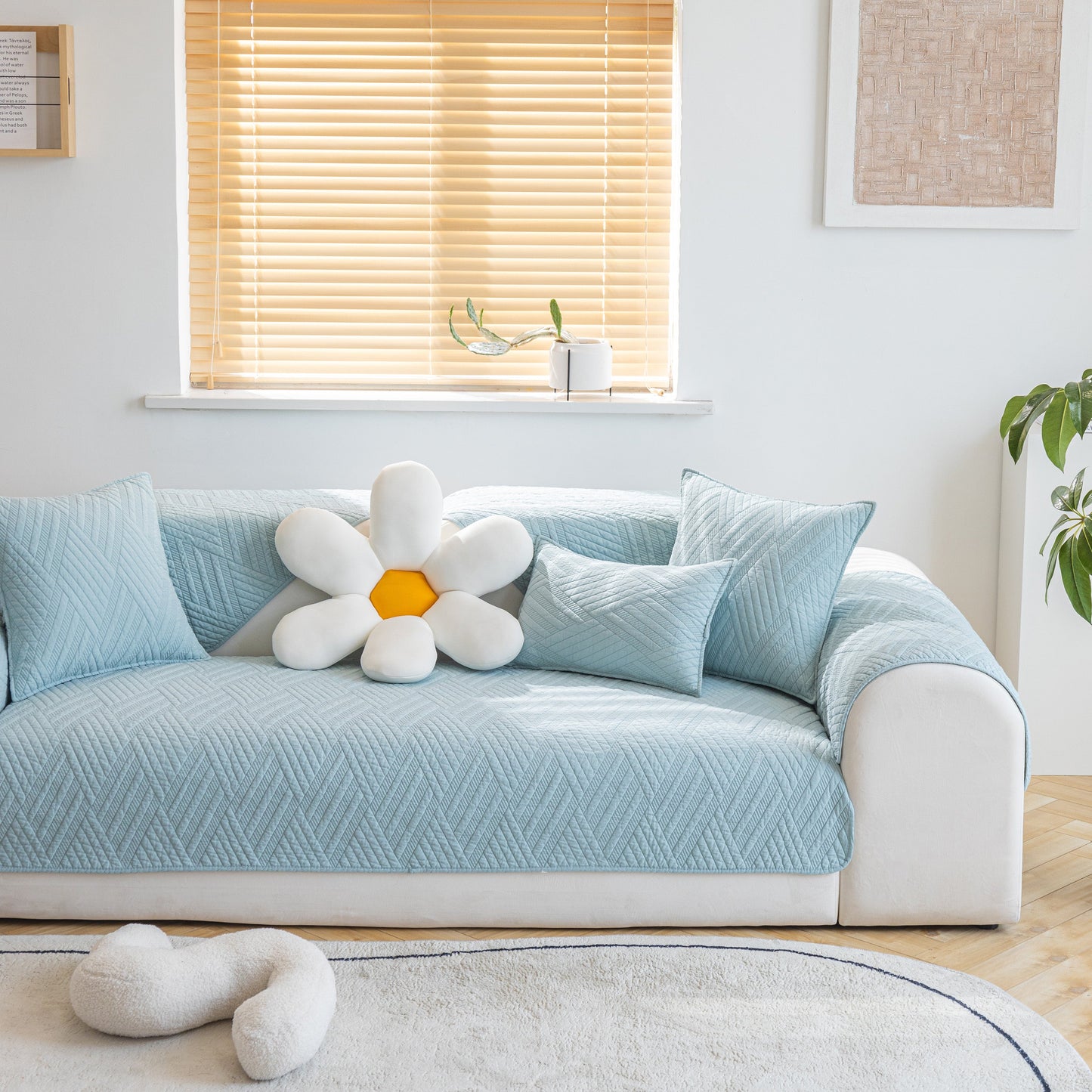 Quilted Geometric Cotton Sofa Cover, Non-Slip & Thick Padded Furniture Covers, light blue with textured pattern on white sofa.
