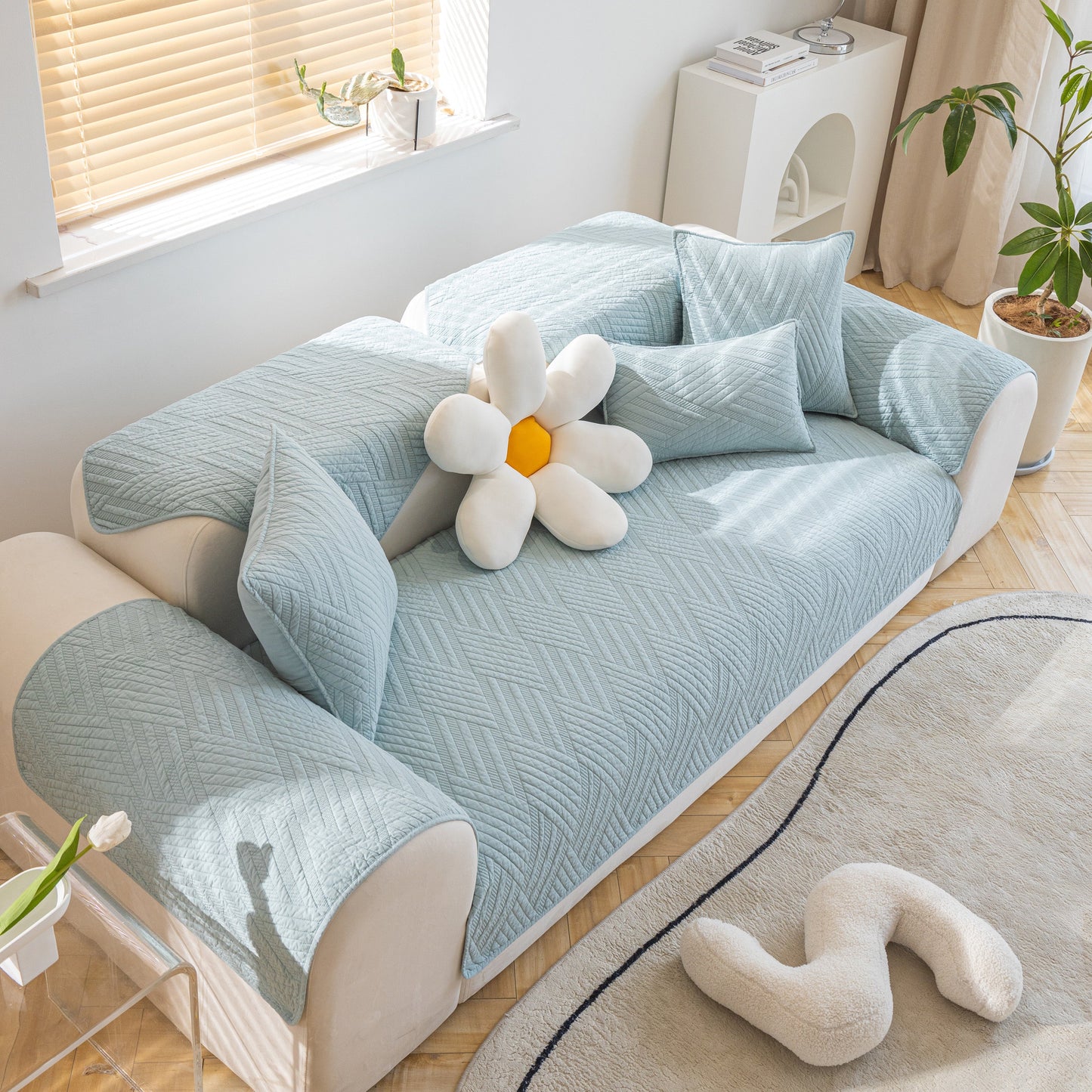 Quilted Geometric Cotton Sofa Cover, Non-Slip & Thick Padded Furniture Covers with diagonal stitching on a modern sofa setup