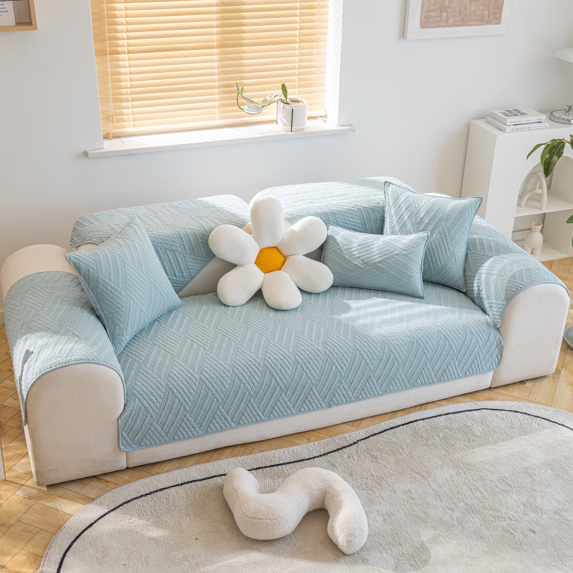 Stylish living room with Quilted Geometric Cotton Sofa Cover, Non-Slip & Thick Padded Furniture Covers in blue.