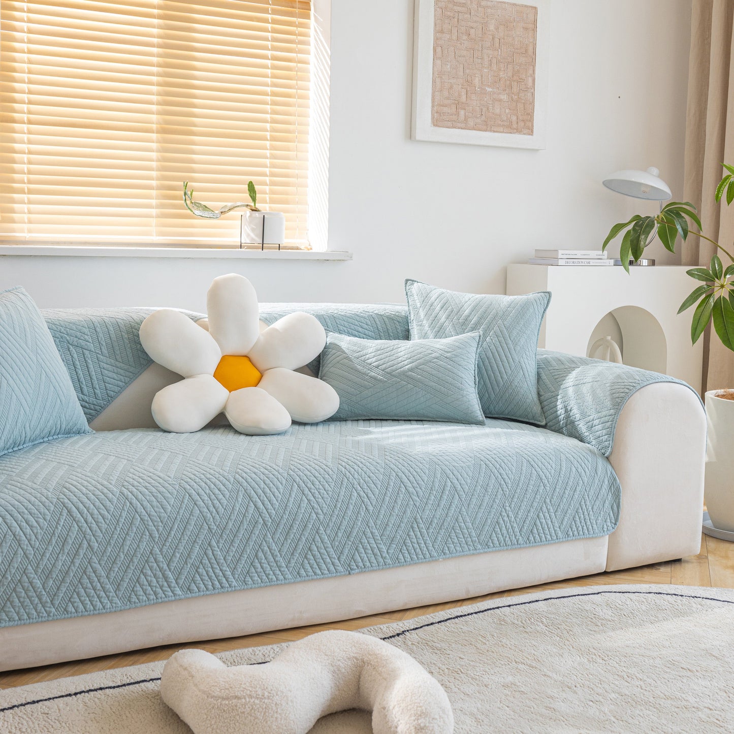 Quilted Geometric Cotton Sofa Cover, Non-Slip & Thick Padded Furniture Covers on a sofa with pillows in a cozy room