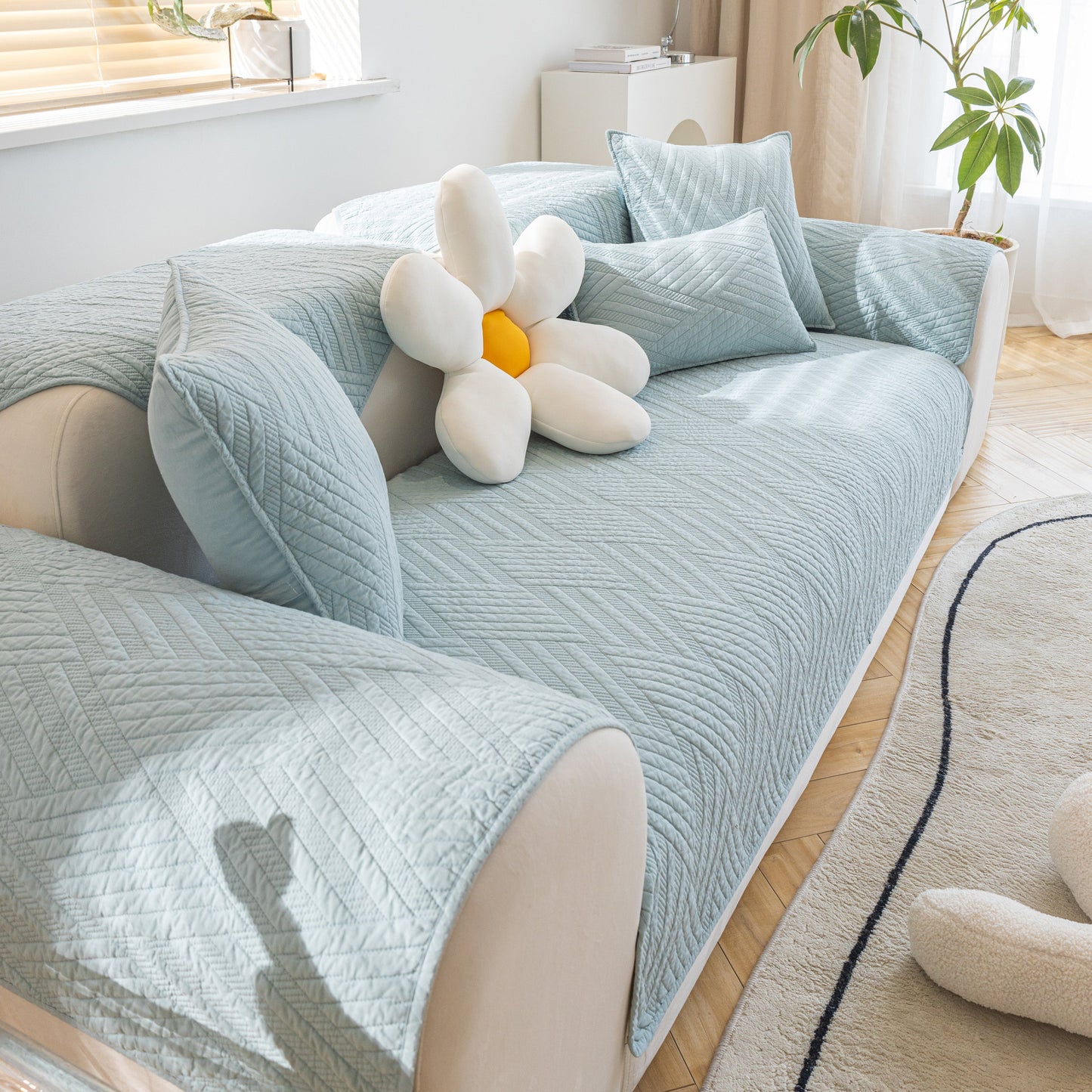 Quilted Geometric Cotton Sofa Cover, Non-Slip & Thick Padded Furniture Covers on a stylish sofa.