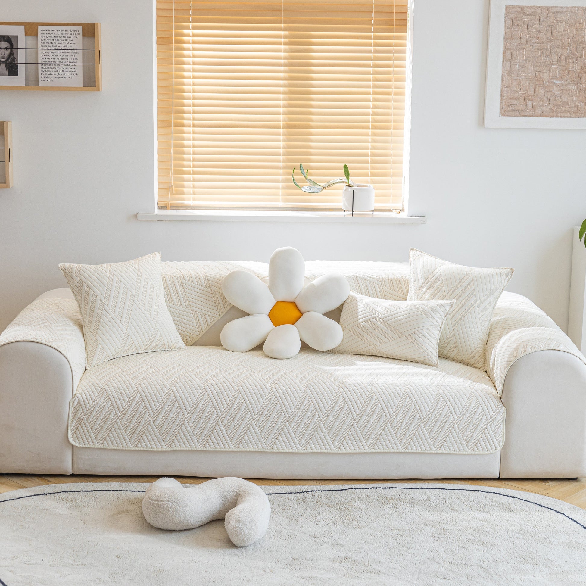 Quilted Geometric Cotton Sofa Cover, Non-Slip & Thick Padded Furniture Covers on white sofa with decorative pillows.