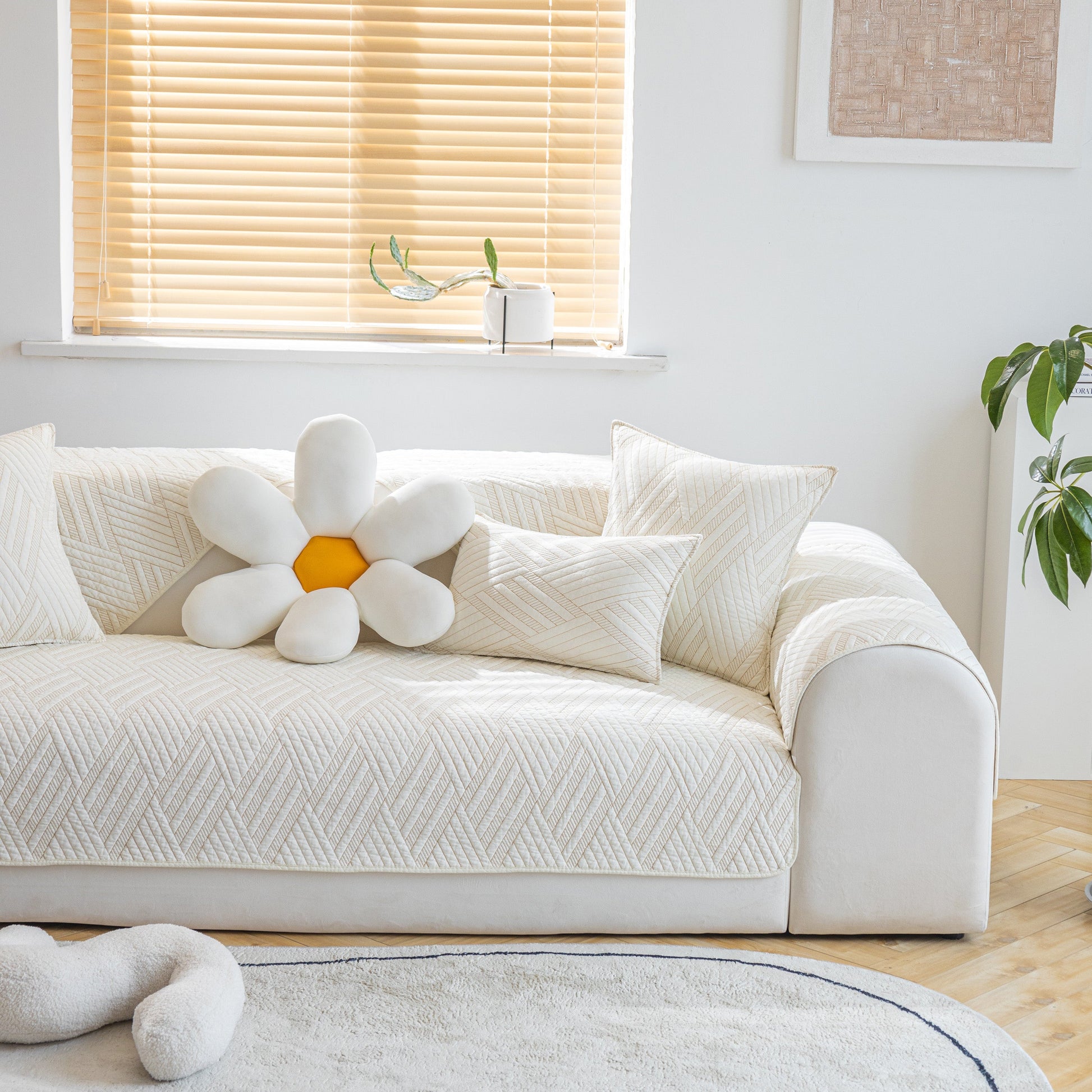 Cozy living room with a Quilted Geometric Cotton Sofa Cover, Non-Slip & Thick Padded Furniture Covers in a modern setting.