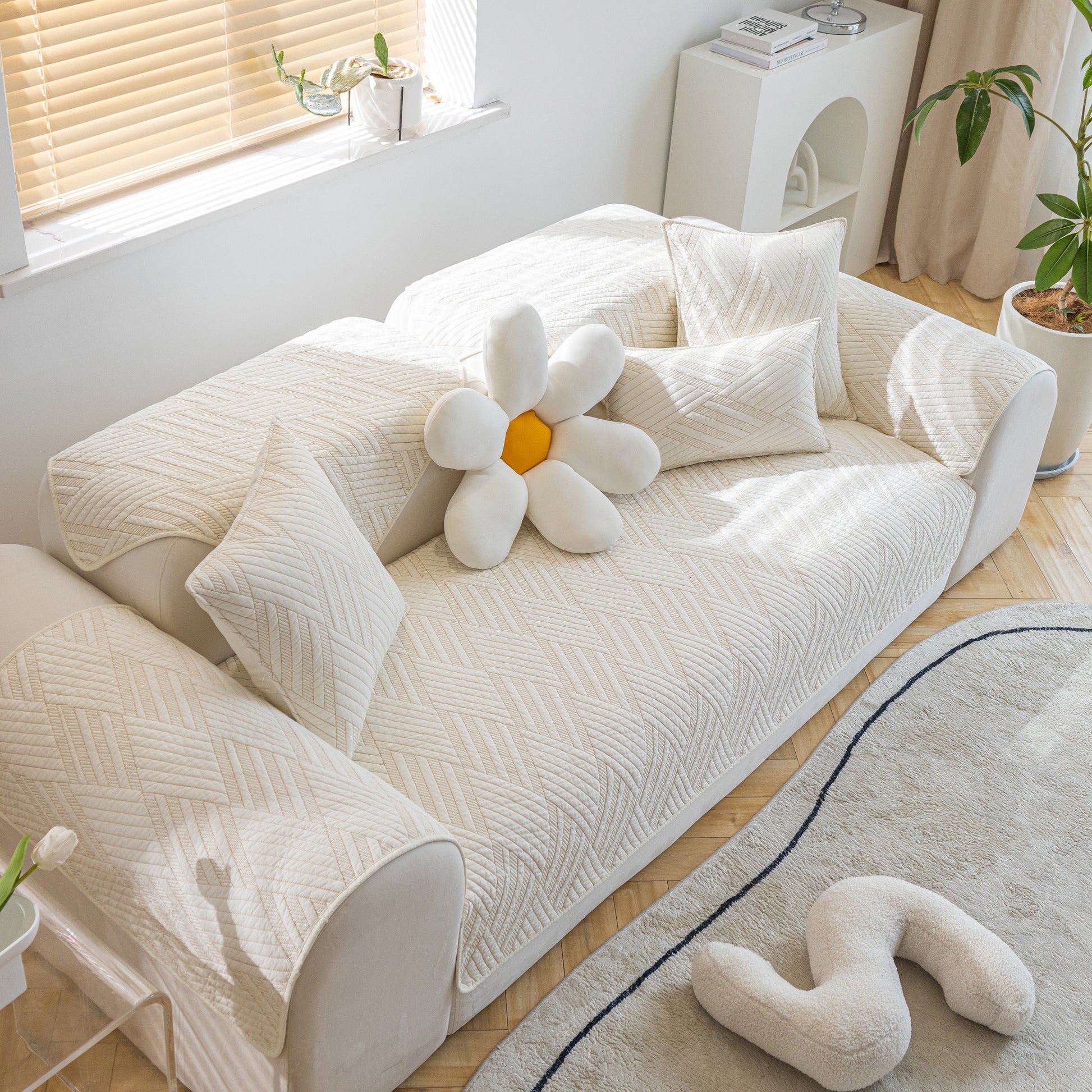 Quilted Geometric Cotton Sofa Cover, Non-Slip & Thick Padded Furniture Covers on white sofa with geometric pattern