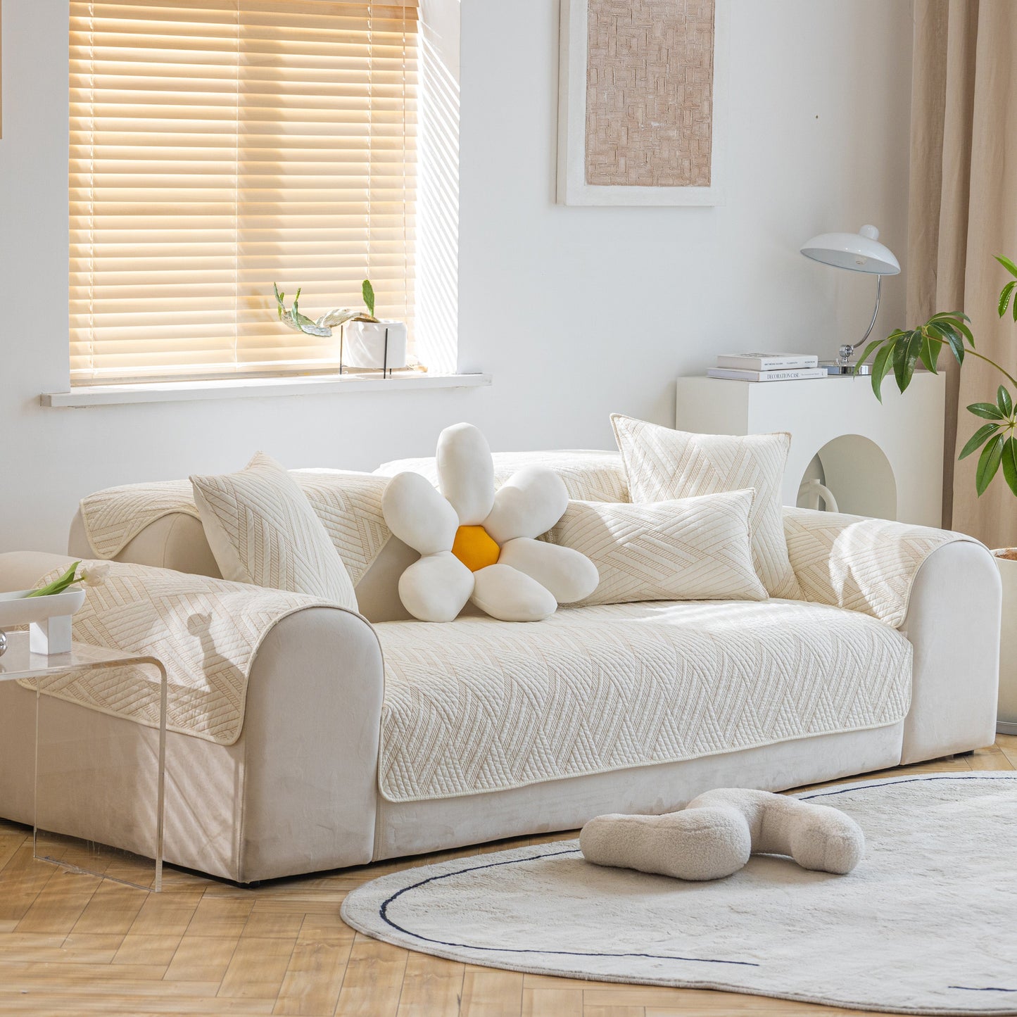 Quilted Geometric Cotton Sofa Cover, Non-Slip & Thick Padded Furniture Covers on a beige couch with decorative pillows in a sunlit room.