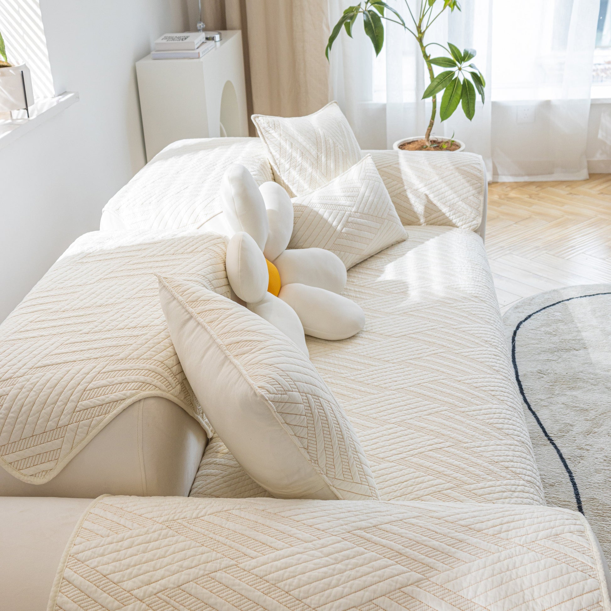Quilted Geometric Cotton Sofa Cover, Non-Slip & Thick Padded Furniture Covers on a modern sofa with cushion accents in natural light.