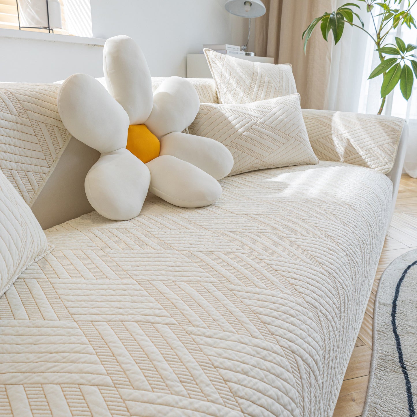 Quilted Geometric Cotton Sofa Cover, Non-Slip & Thick Padded Furniture Covers on a modern sofa with decorative cushion
