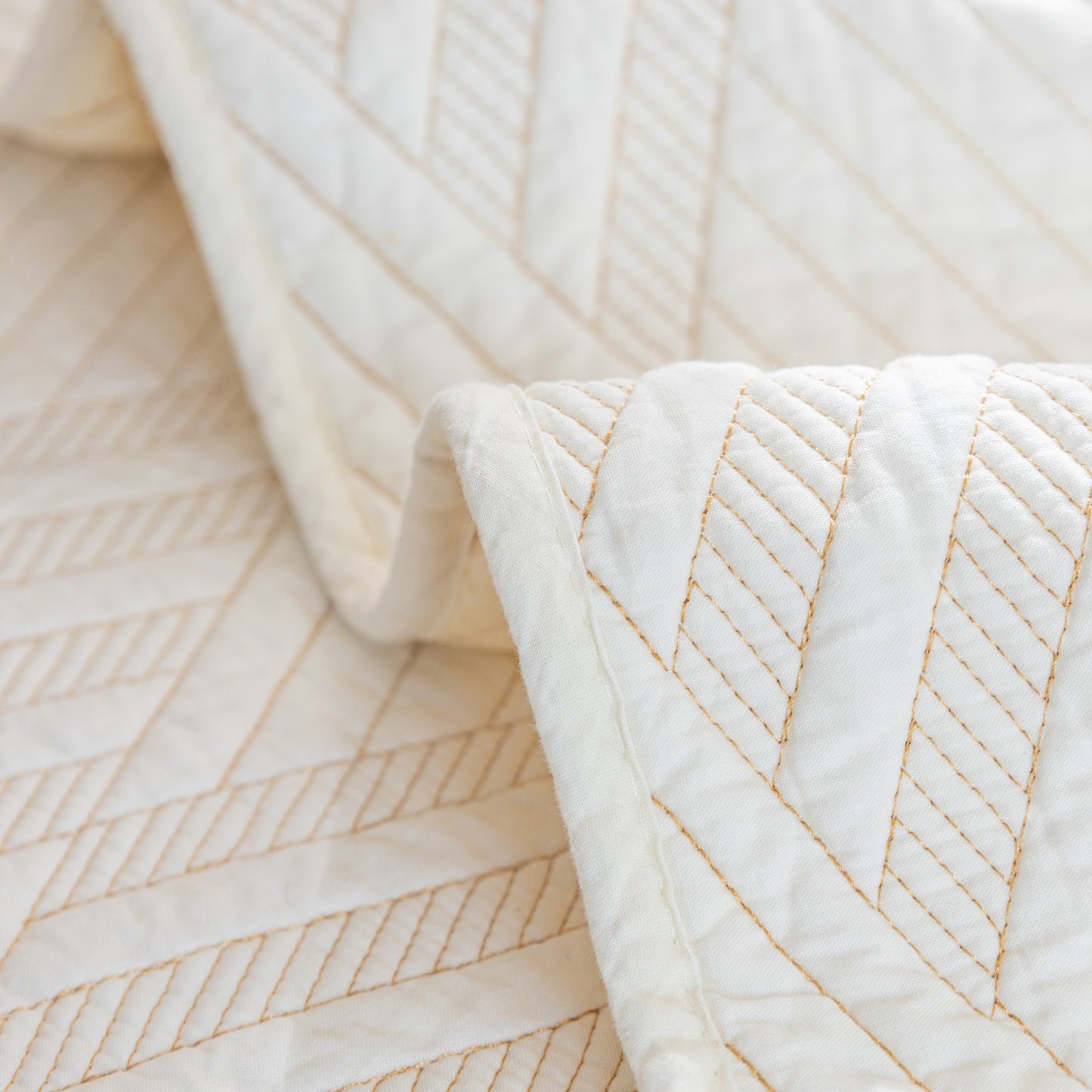 Quilted Geometric Cotton Sofa Cover, Non-Slip & Thick Padded Furniture Covers with diagonal stitching pattern.