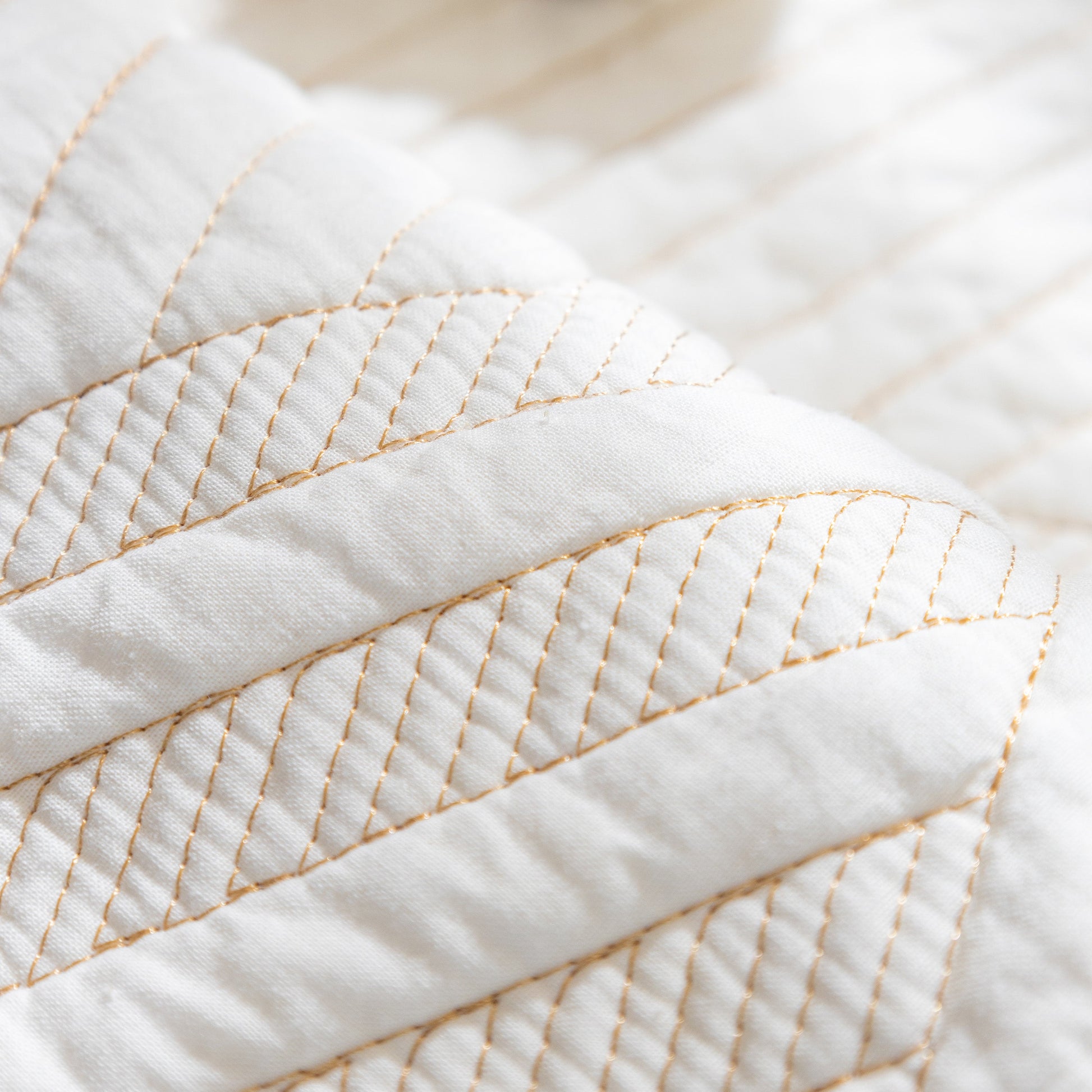 Close-up of Quilted Geometric Cotton Sofa Cover, showing non-slip thick padded furniture covers with diagonal stitching.