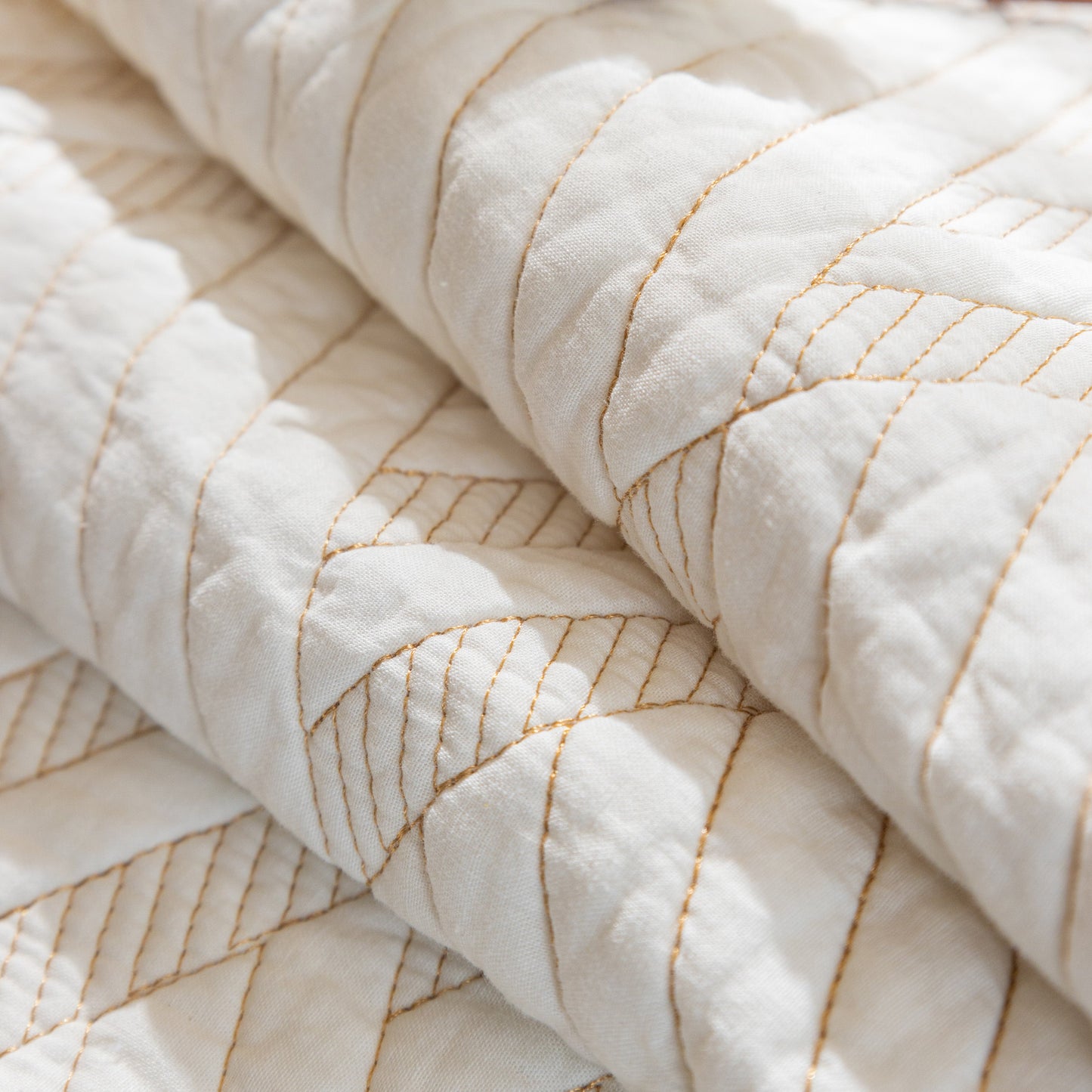 Close-up of Quilted Geometric Cotton Sofa Cover, Non-Slip & Thick Padded Furniture Covers with textured diagonal pattern.