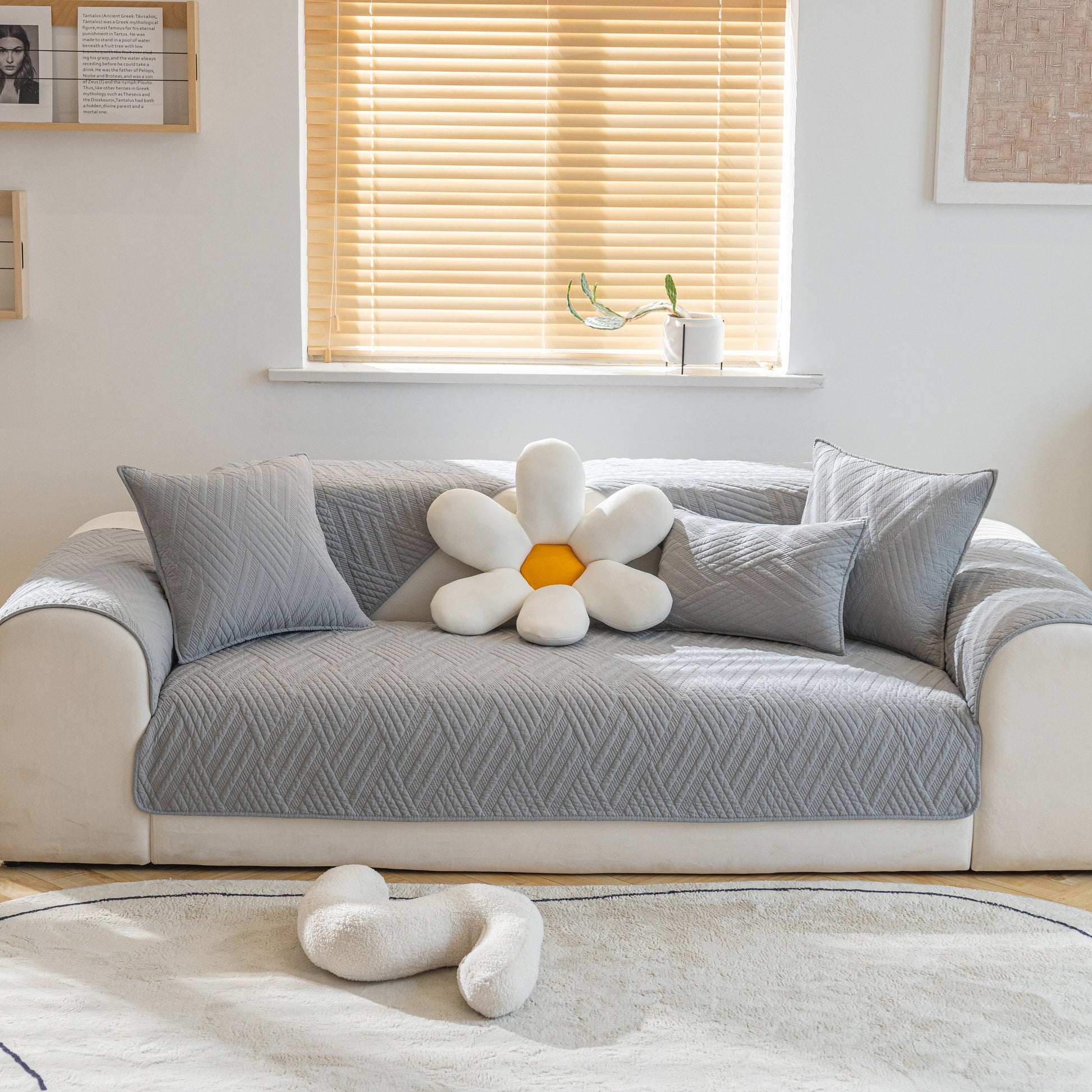 Quilted Geometric Cotton Sofa Cover, Non-Slip & Thick Padded Furniture Covers on a living room sofa with decorative pillows.