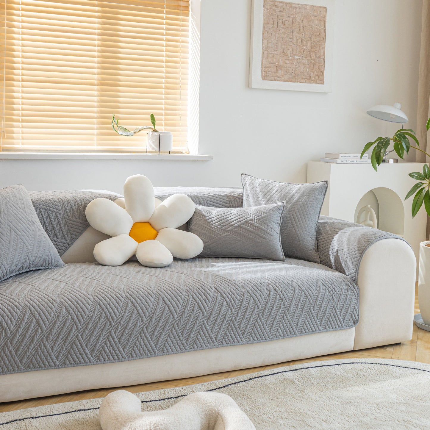 Quilted Geometric Cotton Sofa Cover, Non-Slip & Thick Padded Furniture Covers on a couch in a cozy living room setting.