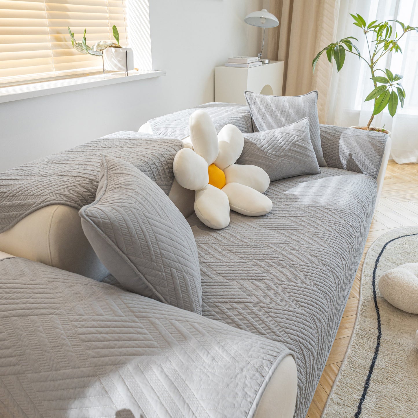 Quilted Geometric Cotton Sofa Cover, Non-Slip & Thick Padded Furniture Covers in a living room setting with cushions.