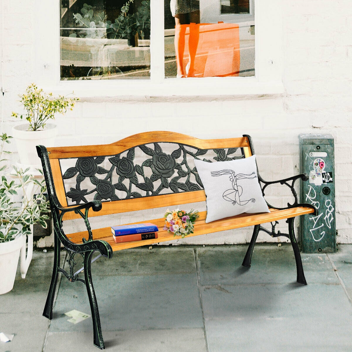 Garden Bench Chair Outdoor Wooden Loveseat with Iron Armrest featuring floral pattern backrest on a patio