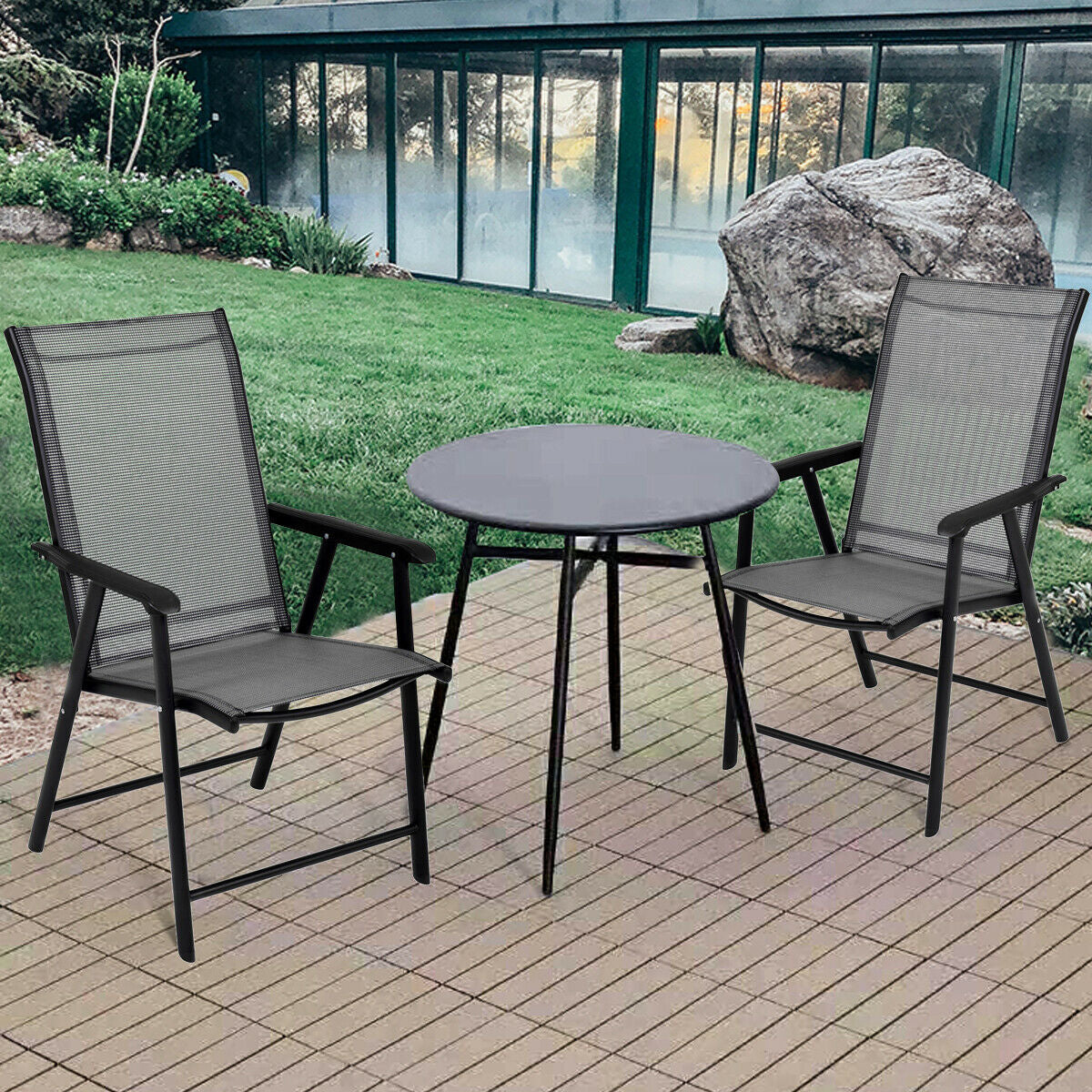 Set of 2 Outdoor Patio Folding Chairs-Gray with table in garden setting, featuring durable steel frame and ergonomic armrests.